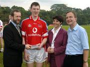 21 January 2006; Niall Gilligan, Clare, who played on the 2004 Vodafone All-Stars team, is presented with a commerative medel by GAA President Sean Kelly in the company of Helen Marks, Head of Brand and Marcomms, Vodafone Ireland and Minister for Transport Martin Cullen, T.D., after the game. Exhibition Game, 2004 Vodafone All-Stars v 2005 Vodafone All-Stars, Singapore Polo Club, Singapore. Picture credit; Ray McManus / SPORTSFILE