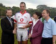 21 January 2006; Darragh Ryan, Wexford, who played on the 2005 Vodafone All-Stars team, is presented with a commerative medal by GAA President Sean Kelly in the company of Helen Marks, Head of Brand and Marcomms, Vodafone Ireland and Minister for Transport Martin Cullen, T.D., after the game. Exhibition Game, 2004 Vodafone All-Stars v 2005 Vodafone All-Stars, Singapore Polo Club, Singapore. Picture credit; Ray McManus / SPORTSFILE