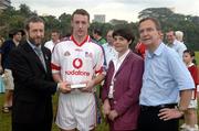 21 January 2006; Damien Joyce, Galway, who played on the 2005 Vodafone All-Stars team, is presented with a commerative medal by GAA President Sean Kelly in the company of Helen Marks, Head of Brand and Marcomms, Vodafone Ireland and Minister for Transport Martin Cullen, T.D., after the game. Exhibition Game, 2004 Vodafone All-Stars v 2005 Vodafone All-Stars, Singapore Polo Club, Singapore. Picture credit; Ray McManus / SPORTSFILE