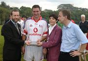 21 January 2006; Derek Hardiman, Galway, who played on the 2005 Vodafone All-Stars team, is presented with a commerative medal by GAA President Sean Kelly in the company of Helen Marks, Head of Brand and Marcomms, Vodafone Ireland and Minister for Transport Martin Cullen, T.D., after the game. Exhibition Game, 2004 Vodafone All-Stars v 2005 Vodafone All-Stars, Singapore Polo Club, Singapore. Picture credit; Ray McManus / SPORTSFILE