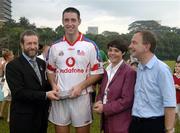 21 January 2006; David 'Doc' O'Connor, Wexford, who played on the 2005 Vodafone All-Stars team, is presented with a commerative medel by GAA President Sean Kelly in the company of Helen Marks, Head of Brand and Marcomms, Vodafone Ireland and Minister for Transport Martin Cullen, T.D., after the game. Exhibition Game, 2004 Vodafone All-Stars v 2005 Vodafone All-Stars, Singapore Polo Club, Singapore. Picture credit; Ray McManus / SPORTSFILE