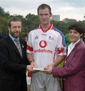21 January 2006; Tony Og Regan, Galway, who played on the 2005 Vodafone All-Stars team, is presented with a commerative medel by GAA President Sean Kelly in the company of Helen Marks, Head of Brand and Marcomms, Vodafone Ireland after the game. Exhibition Game, 2004 Vodafone All-Stars v 2005 Vodafone All-Stars, Singapore Polo Club, Singapore. Picture credit; Ray McManus / SPORTSFILE