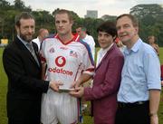 21 January 2006; Fergal Healy, Galway, who played on the 2005 Vodafone All-Stars team, is presented with a commerative medal by GAA President Sean Kelly in the company of Helen Marks, Head of Brand and Marcomms, Vodafone Ireland and Minister for Transport Martin Cullen, T.D., after the game. Exhibition Game, 2004 Vodafone All-Stars v 2005 Vodafone All-Stars, Singapore Polo Club, Singapore. Picture credit; Ray McManus / SPORTSFILE