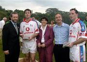21 January 2006; Paul and Eoin Kelly, Tippery, who played on the 2005 Vodafone All-Stars team, is presented with a commerative medel by GAA President Sean Kelly in the company of Helen Marks, Head of Brand and Marcomms, Vodafone Ireland and Minister for Transport Martin Cullen, T.D., after the game. Exhibition Game, 2004 Vodafone All-Stars v 2005 Vodafone All-Stars, Singapore Polo Club, Singapore. Picture credit; Ray McManus / SPORTSFILE
