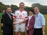 21 January 2006; Seamus Prendergast, Waterford, who played on the 2005 Vodafone All-Stars team, is presented with a commerative medal by GAA President Sean Kelly in the company of Helen Marks, Head of Brand and Marcomms, Vodafone Ireland and Minister for Transport Martin Cullen, T.D., after the game. Exhibition Game, 2004 Vodafone All-Stars v 2005 Vodafone All-Stars, Singapore Polo Club, Singapore. Picture credit; Ray McManus / SPORTSFILE