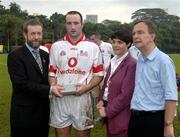 21 January 2006; Ger Farragher, Galway, who played on the 2005 Vodafone All-Stars team, is presented with a commerative medal by GAA President Sean Kelly in the company of Helen Marks, Head of Brand and Marcomms, Vodafone Ireland and Minister for Transport Martin Cullen, T.D., after the game. Exhibition Game, 2004 Vodafone All-Stars v 2005 Vodafone All-Stars, Singapore Polo Club, Singapore. Picture credit; Ray McManus / SPORTSFILE