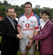 21 January 2006; David Forde, Galway, who played on the 2005 Vodafone All-Stars team, is presented with a commerative medel by GAA President Sean Kelly in the company of Helen Marks, Head of Brand and Marcomms, Vodafone Ireland after the game. Exhibition Game, 2004 Vodafone All-Stars v 2005 Vodafone All-Stars, Singapore Polo Club, Singapore. Picture credit; Ray McManus / SPORTSFILE