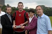 21 January 2006; Ken McGrath, Waterford, who was on the 2004 Vodafone All-Stars selection, is presented with a commerative medal by GAA President Sean Kelly in the company of Helen Marks, Head of Brand and Marcomms, Vodafone Ireland and Minister for Transport Martin Cullen, T.D., after the game. Exhibition Game, 2004 Vodafone All-Stars v 2005 Vodafone All-Stars, Singapore Polo Club, Singapore. Picture credit; Ray McManus / SPORTSFILE