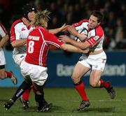 27 January 2006; Isaac Boss, Ulster, is tackled by Alix Popham, Llanelli Scarlets. Celtic League 2005-2006, Group A, Ulster v Llanelli Scarlets, Ravenhill, Belfast. Picture credit: Oliver McVeigh / SPORTSFILE