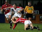 27 January 2006; Andy Maxwell, Ulster, is tackled by Clive Syuart Smith, Llanelli Scarlets. Celtic League 2005-2006, Group A, Ulster v Llanelli Scarlets, Ravenhill, Belfast. Picture credit: Oliver McVeigh / SPORTSFILE