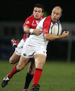 27 January 2006; Adam Larkin, Ulster, is tackled by Gareth Bowen, Llanelli Scarlets. Celtic League 2005-2006, Group A, Ulster v Llanelli Scarlets, Ravenhill, Belfast. Picture credit: Oliver McVeigh / SPORTSFILE