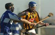 29 January 2006; Seaghain O'Neill, Kilkenny, in action against Pakie Cuddy, Laois. Walsh Cup, Laois v Kilkenny, Kelly Daly Park, Rathdowney, Co. Laois. Picture credit: Damien Eagers / SPORTSFILE