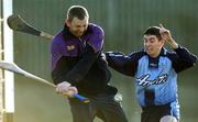 29 January 2006; Wexford goalkeeper Damien Fitzhenry, in action against Alan McCrabbe, Dublin. Walsh Cup, Dublin v Wexford, Parnell Park, Dublin. Picture credit: Brian Lawless / SPORTSFILE