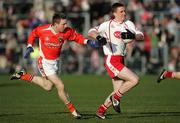 29 January 2006; Tommy McGuigan, Tyrone, in action against Paul Duffy, Armagh. McKenna Cup Semi-Final, Tyrone v Armagh, Casement Park, Belfast. Picture credit: Oliver McVeigh / SPORTSFILE