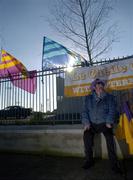 29 January 2006; A 'Hats or Flags' trader known as 'The Ragman' awaits some business before the match. Walsh Cup, Dublin v Wexford, Parnell Park, Dublin. Picture credit: Brian Lawless / SPORTSFILE
