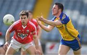 19 April 2014; Diarmuid Murtagh, Roscommon, in action against Stephen Cronin, Cork. Cadbury GAA Football U21 Championship Semi-Final, Cork v Roscommon, O'Moore Park, Portlaoise, Co. Laois.  Picture credit: Brendan Moran / SPORTSFILE