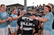 19 April 2014; Philip O'Dwyer, Old Belvedere, is comforted by Garryowen players as he and his team-mates leave the pitch after the game. Ulster Bank League Division 1A, Garryowen v Old Belvedere, Dooradoyle, Limerick. Picture credit: Ray McManus / SPORTSFILE