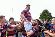 19 April 2014; Clontarf's Tony Ryan is lifted by team-mate Michael McGrath after the team found out that Old Belvedere had been beaten by Garryowen to award Clontarf the league. Ulster Bank League Division 1A, Clontarf v Ballynahinch, Castle Avenue, Clontarf, Dublin. Picture credit: Ramsey Cardy / SPORTSFILE
