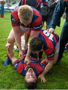 19 April 2014; Clontarf's Michael McGrath, bottom, David Hegarty, left, and Peter du Toit celebrate after the match. Ulster Bank League Division 1A, Clontarf v Ballynahinch, Castle Avenue, Clontarf, Dublin. Picture credit: Ramsey Cardy / SPORTSFILE