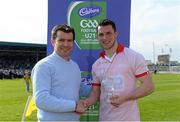 19 April 2014; Roscommon's Diarmuid Murtagh is presented with the Man of the Match Award by Ray O'Mahony, Cadbury Ireland. Cadbury GAA Football U21 Championship Semi-Final, Cork v Roscommon, O'Moore Park, Portlaoise, Co. Laois.  Picture credit: Brendan Moran / SPORTSFILE