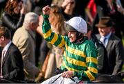 21 April 2014; Jockey Barry Geraghty celebrates as he is lead into the winners enclosure on Shutthefrontdoor after winning the Boylesports Irish Grand National Steeplechase. Fairyhouse Easter Festival, Fairyhouse, Co. Meath. Picture credit: Barry Cregg / SPORTSFILE