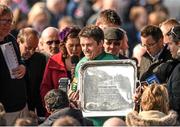 21 April 2014; Jockey Barry Geraghty holds up the winning trophy after he rode Shutthefrontdoor to victory in the Boylesports Irish Grand National Steeplechase. Fairyhouse Easter Festival, Fairyhouse, Co. Meath. Picture credit: Barry Cregg / SPORTSFILE