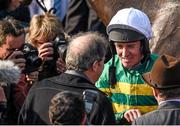 21 April 2014; Jockey Barry Geraghty speaking to owner JP McManus after he rode his horse Shutthefrontdoor to victory in the Boylesports Irish Grand National Steeplechase. Fairyhouse Easter Festival, Fairyhouse, Co. Meath. Picture credit: Barry Cregg / SPORTSFILE