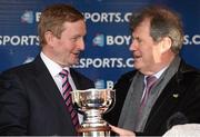 21 April 2014; An Taoisech Enda kenny, T.D, makes a presentation to winning owner JP McManus after the Boylesports Irish Grand National Steeplechase. Fairyhouse Easter Festival, Fairyhouse, Co. Meath. Picture credit: Brendan Moran / SPORTSFILE