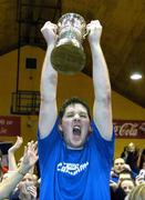 29 January 2006; UCC Demons captain Niall O'Reilly lifts the cup after victory over Limerick Lions. Superleague Men's Cup Final, UCC Demons v Limerick Lions, National Basketball Arena, Tallaght, Dublin. Picture credit: Brendan Moran / SPORTSFILE