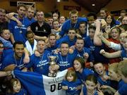 29 January 2006; The UCC Demons team and supporters celebrate with the cup after the game. Superleague Men's Cup Final, UCC Demons v Limerick Lions, National Basketball Arena, Tallaght, Dublin. Picture credit: Brendan Moran / SPORTSFILE