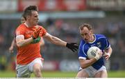 29 May 2016; Martin Reilly of Cavan in action against Mark Shields of Armagh in the Ulster GAA Football Senior Championship quarter-final between Cavan and Armagh at Kingspan Breffni Park, Cavan. Photo by Ramsey Cardy/Sportsfile