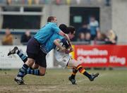 30 January 2006; Ken Doherty, Presentation College Bray, is tackled by Conor Cleary, left, and Noel Reid, St. Michael's College. Leinster Schools Senior Cup, First Round, Presentation College Bray v St. Michael's College, Donnybrook, Dublin. Picture credit; David Levingstone / SPORTSFILE