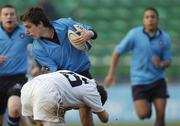 30 January 2006; Michael Twomey, St. Michael's College, is tackled by Sean Quinn, Presentation College Bray. Leinster Schools Senior Cup, First Round, Presentation College Bray v St. Michael's College, Donnybrook, Dublin. Picture credit; Pat Murphy / SPORTSFILE