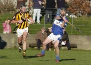 29 January 2006; John Brophy, Laois, in action against Derek Lyng, Kilkenny. Walsh Cup, Laois v Kilkenny, Kelly Daly Park, Rathdowney, Co. Laois. Picture credit; Damien Eagers / SPORTSFILE