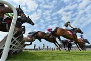 21 April 2014; Runners and riders, including eventual winner Ivan Grozny, 2nd from right no. 8, with Paul Townend up, clear the last first time round, during the Tayto Hurdle. Fairyhouse Easter Festival, Fairyhouse, Co. Meath. Picture credit: Brendan Moran / SPORTSFILE