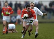 5 February 2006; Andy Mallon, Armagh, in action against Glenn Ryan, Kildare. Allianz National Football League, Division 1B, Round 1, Armagh v Kildare, St. Oliver Plunkett Park, Crossmaglen, Co. Armagh. Picture credit: Damien Eagers / SPORTSFILE
