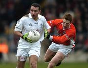 5 February 2006; Padraig Brennan, Kildare, in action against Charlie Vernon, Armagh. Allianz National Football League, Division 1B, Round 1, Armagh v Kildare, St. Oliver Plunkett Park, Crossmaglen, Co. Armagh. Picture credit: Damien Eagers / SPORTSFILE