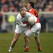 5 February 2006; Glenn Ryan, Kildare, in action against J P Donnelly, Armagh. Allianz National Football League, Division 1B, Round 1, Armagh v Kildare, St. Oliver Plunkett Park, Crossmaglen, Co. Armagh. Picture credit: Damien Eagers / SPORTSFILE