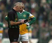 5 February 2006; Niall McNamee, Offaly, is booked by referee Gerry Kinneavy. Allianz National Football League, Division 1A, Round 1, Offaly v Cork, O'Connor Park, Tullamore, Co. Offaly. Picture credit: Ray McManus / SPORTSFILE