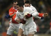 5 February 2006; Andrew McLoughlin, Kildare, in action against Gareth Swift, Armagh. Allianz National Football League, Division 1B, Round 1, Armagh v Kildare, St. Oliver Plunkett Park, Crossmaglen, Co. Armagh. Picture credit: Damien Eagers / SPORTSFILE