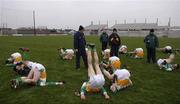 5 February 2006; The Offaly players warm down after the game under the watchful eyes of manager Kevin Kilmurray. Allianz National Football League, Division 1A, Round 1, Offaly v Cork, O'Connor Park, Tullamore, Co. Offaly. Picture credit: Ray McManus / SPORTSFILE
