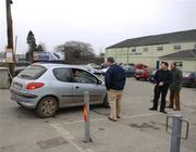 5 February 2006; Officials from the Tullamore GAA Club collect a four euro parking fee from patrons, players, and officials as they arrive to park in the Club car park opposite O'Connor Park. Allianz National Football League, Division 1A, Round 1, Offaly v Cork, O'Connor Park, Tullamore, Co. Offaly. Picture credit: Ray McManus / SPORTSFILE