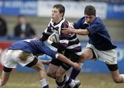 6 February 2006; Gavin Douglas, Terenure College, is tackled by Jeffery Glynn,left, and Ronan Lennon, St. Mary's College. Leinster Schools Junior Cup, 1st Round, St Mary's College v Terenure College, Donnybrook, Dublin. Picture credit; Matt Browne / SPORTSFILE