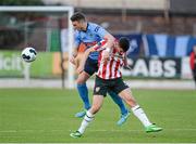 25 April 2014; Robbie Creevy, UCD, in action against Enda Curran, Derry City. Airtricity League Premier Division, Derry City v UCD, Brandywell, Derry. Picture credit: Oliver McVeigh / SPORTSFILE