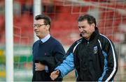 25 April 2014; Derry City manager Roddy Collins and UCD Manager Aaron Callaghan enter the picthside together ahead of the game. Airtricity League Premier Division, Derry City v UCD, Brandywell, Derry. Picture credit: Oliver McVeigh / SPORTSFILE