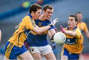 26 April 2014; Conor Sweeney, Tipperary, is tackled by Kevin Hartnett, left, and Martin McMahon, Clare. Allianz Football League Division 4 Final, Tipperary v Clare, Croke Park, Dublin. Picture credit: Barry Cregg / SPORTSFILE