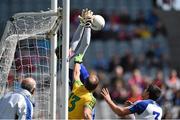 27 April 2014; Monaghan goalkeeper Rory Beggan saves from Colm McFadden, Donegal, as Monaghan's Drew Wylie looks on. Allianz Football League Division 2 Final, Donegal v Monaghan, Croke Park, Dublin. Picture credit: David Maher / SPORTSFILE