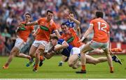 29 May 2016; Tomas Corr of Cavan is tackled by Andy Mallon of Armagh in the Ulster GAA Football Senior Championship quarter-final between Cavan and Armagh at Kingspan Breffni Park, Cavan. Photo by Ramsey Cardy/Sportsfile