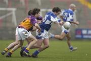 5 February 2006; Chris Conway, Laois, in action against Ciaran Deely and Paddy Colfer, Wexford. Allianz National Football League, Division 1B, Round 1, Laois v Wexford, O'Moore Park, Portlaoise, Co. Laois. Picture credit: Brian Lawless / SPORTSFILE