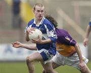 5 February 2006; Donie Brennan, Laois, in action against Ciaran Deely, Wexford. Allianz National Football League, Division 1B, Round 1, Laois v Wexford, O'Moore Park, Portlaoise, Co. Laois. Picture credit: Brian Lawless / SPORTSFILE